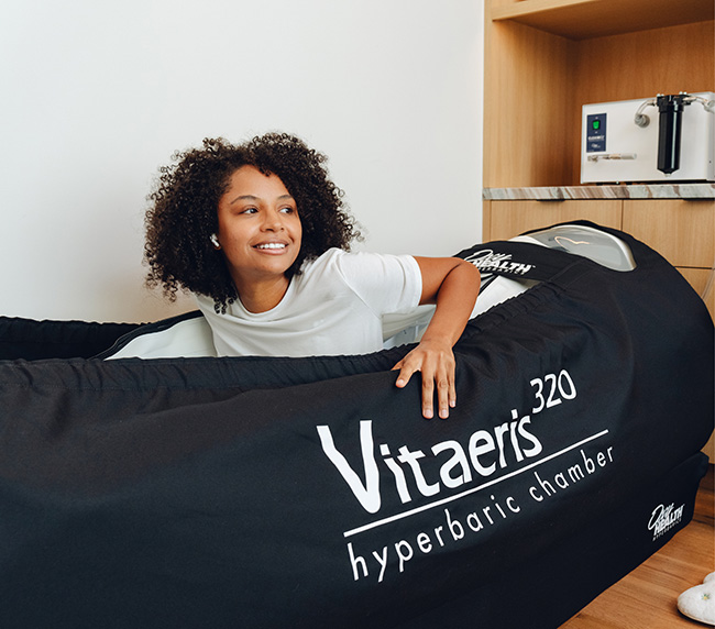 Guest relaxing inside the Vitaeris 320 hyperbaric chamber at iCRYO Mauldin