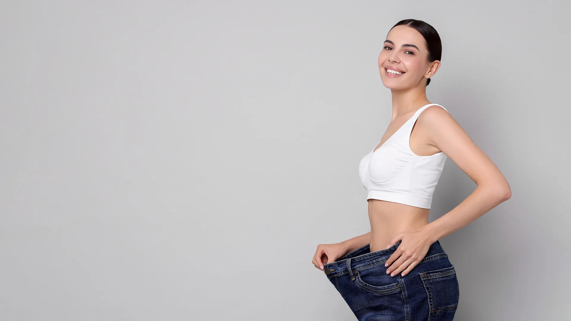 Woman celebrating weight loss results at iCRYO Mauldin Medical Weight Loss program